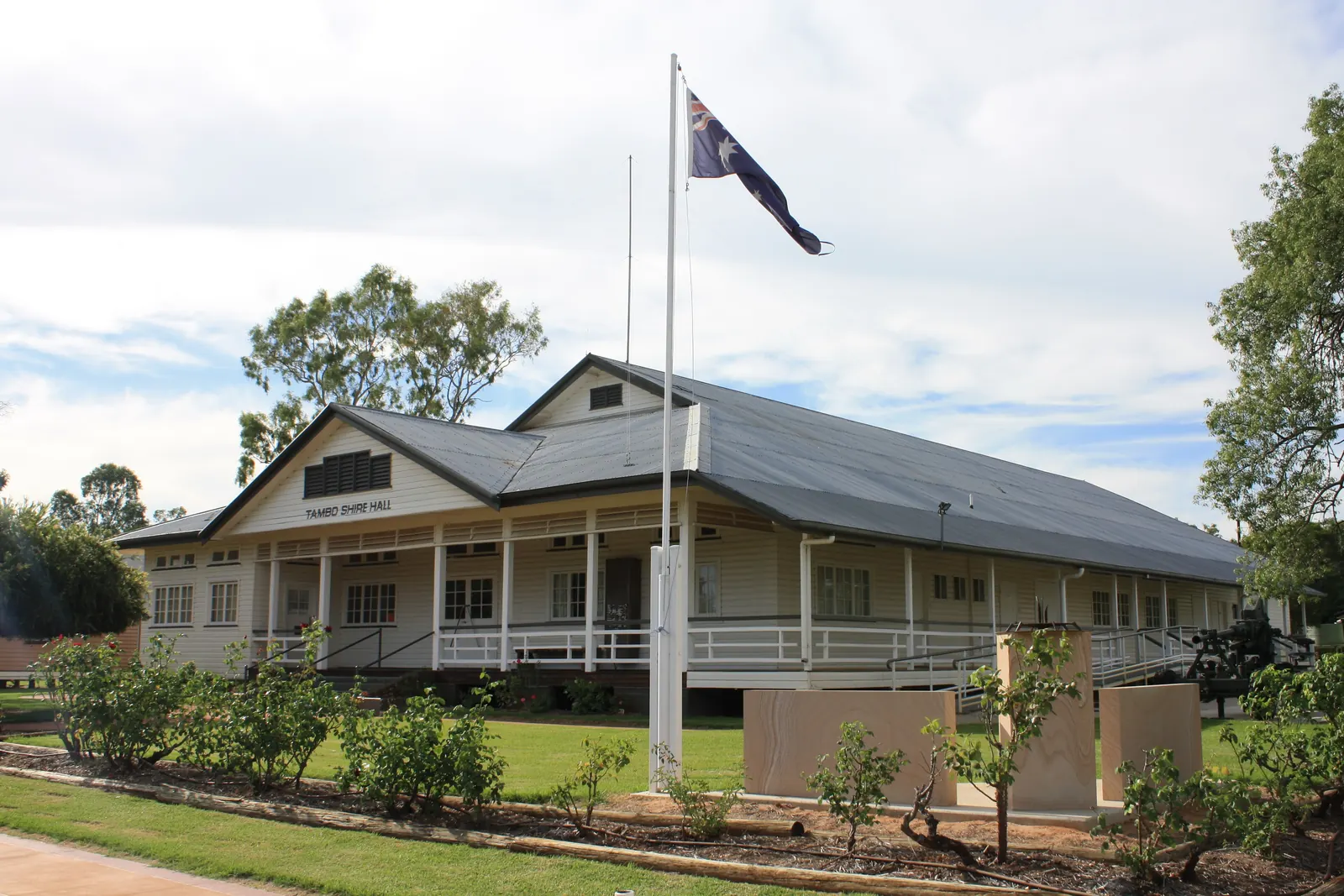 Tambo Shire Hall in Queensland with a flagpole and the Australian National Flag
