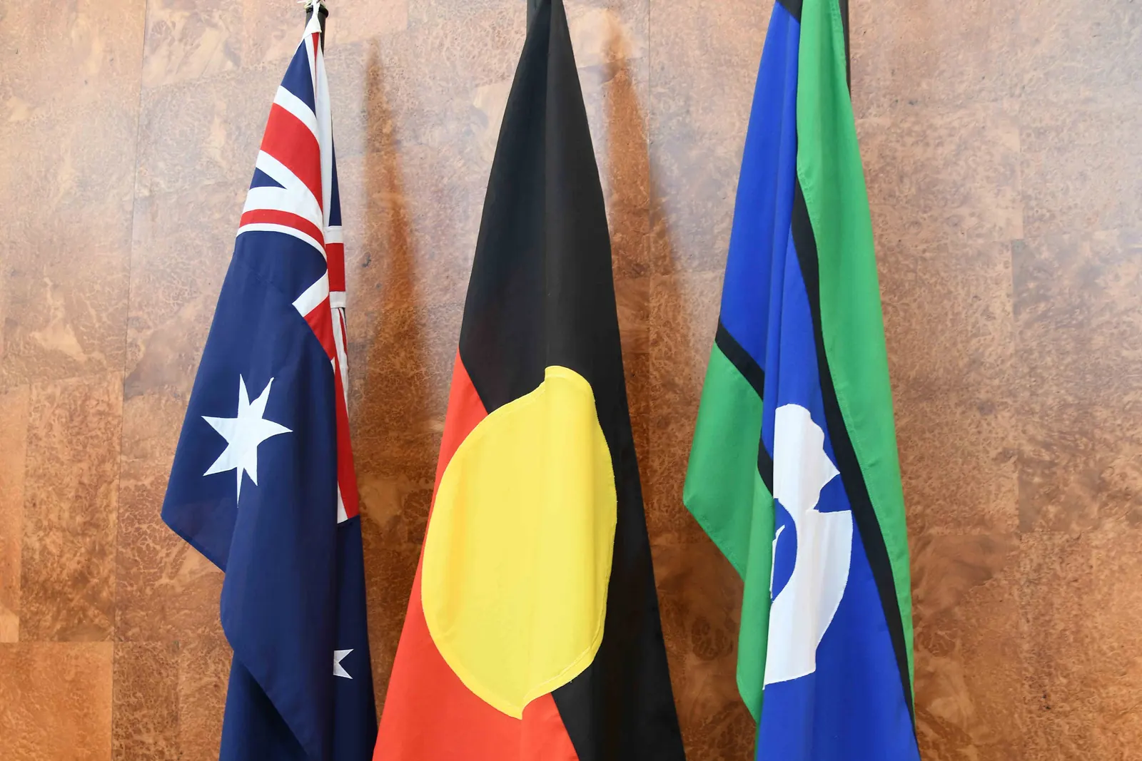 The Australian National Flag, the Australian Aboriginal Flag and the Torres Strait Islander Flag on three flagstaffs