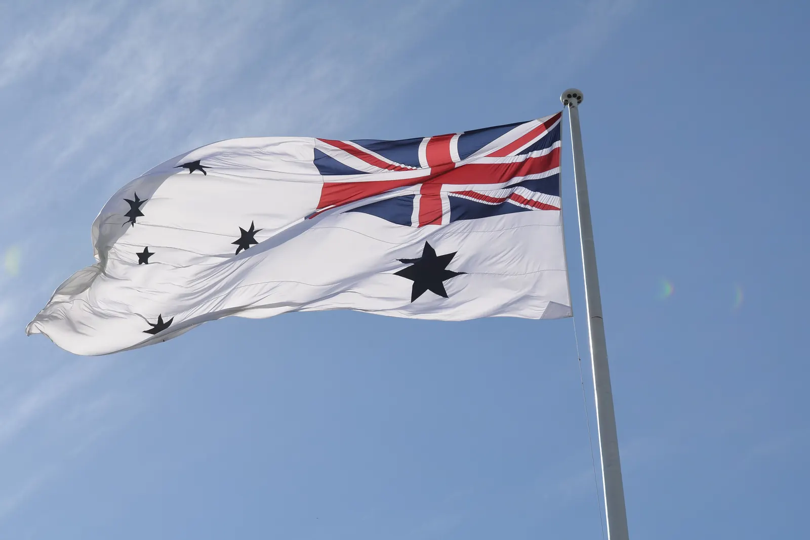 The Australian White Ensign flying at the International Fleet Review in Sydney in 2013
