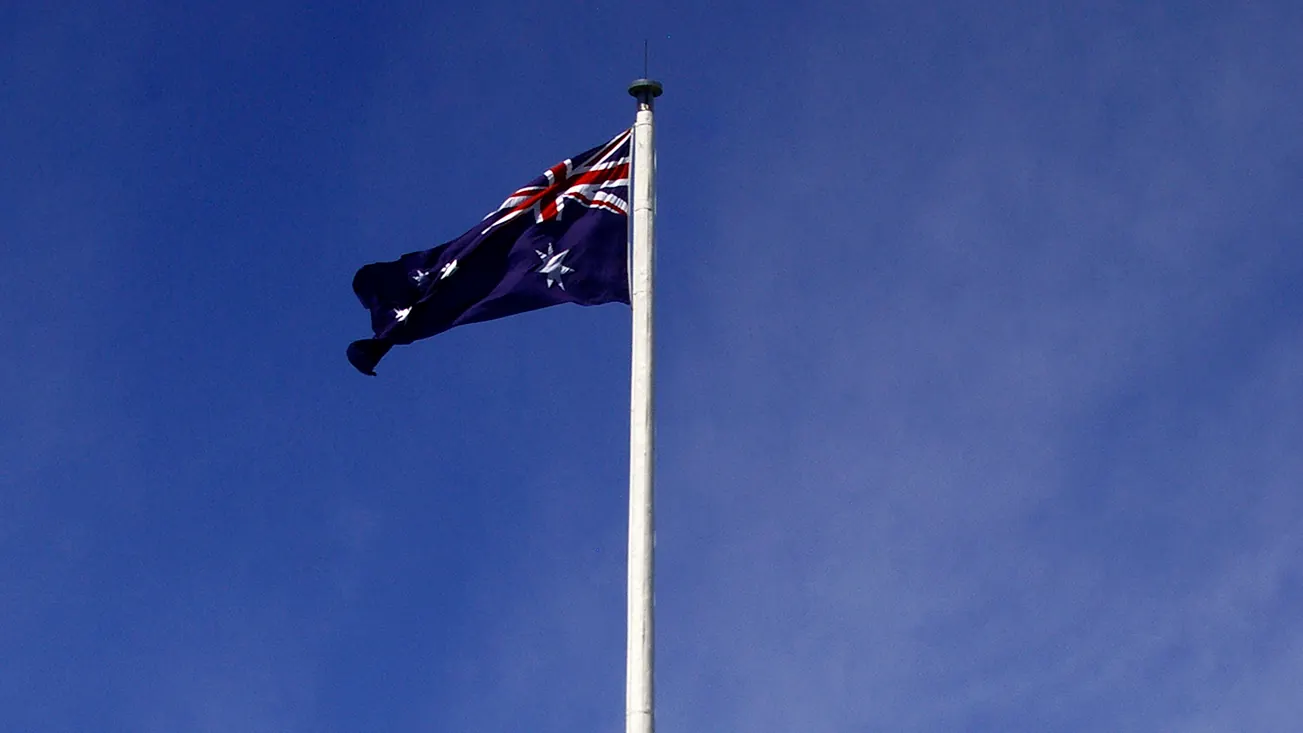 The tall Canadian Flagpole at Regatta Point in Canberra with the Australian National Flag