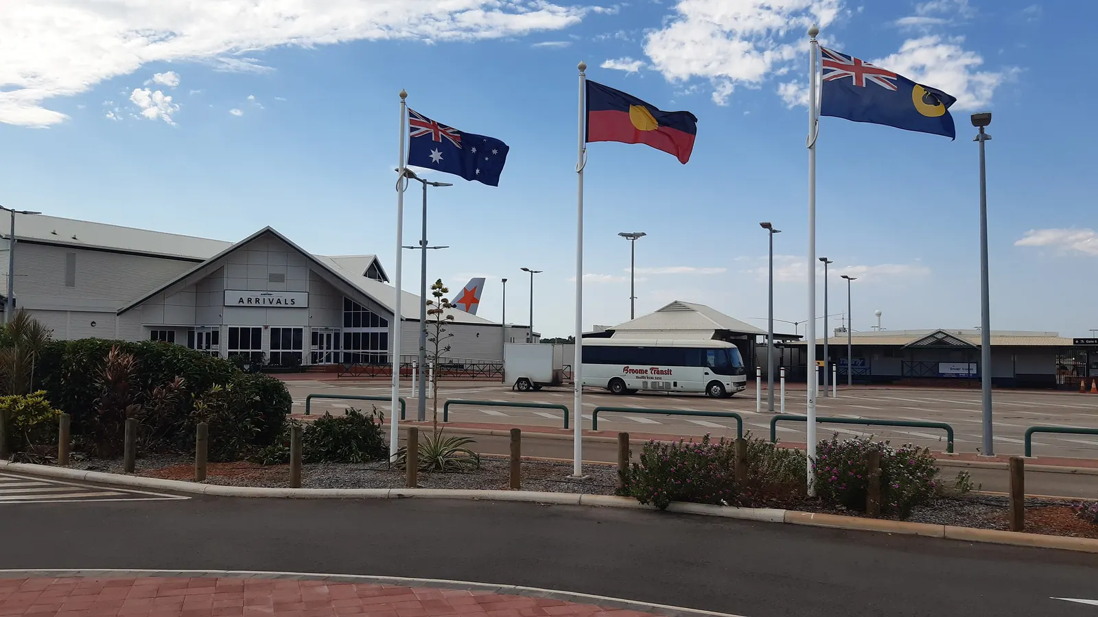Flagpoles with flags at Broome International Airport in Western Australia