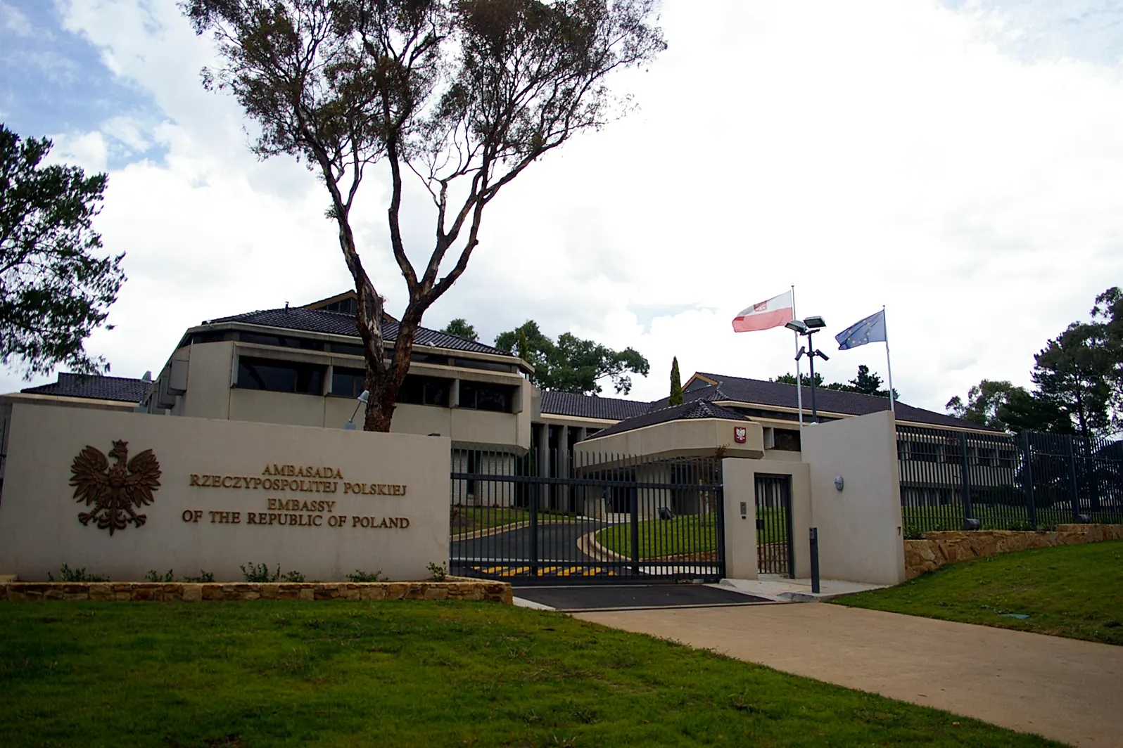The Embassy of Poland in Canberra with the flags of Poland and the European Union