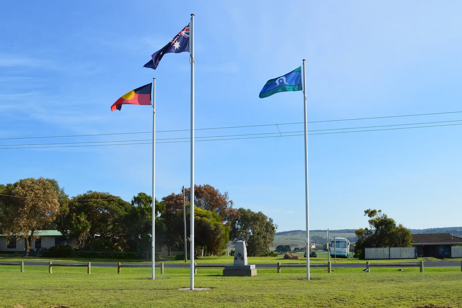 Flagpoles beside a war memorial in south-west Victoria