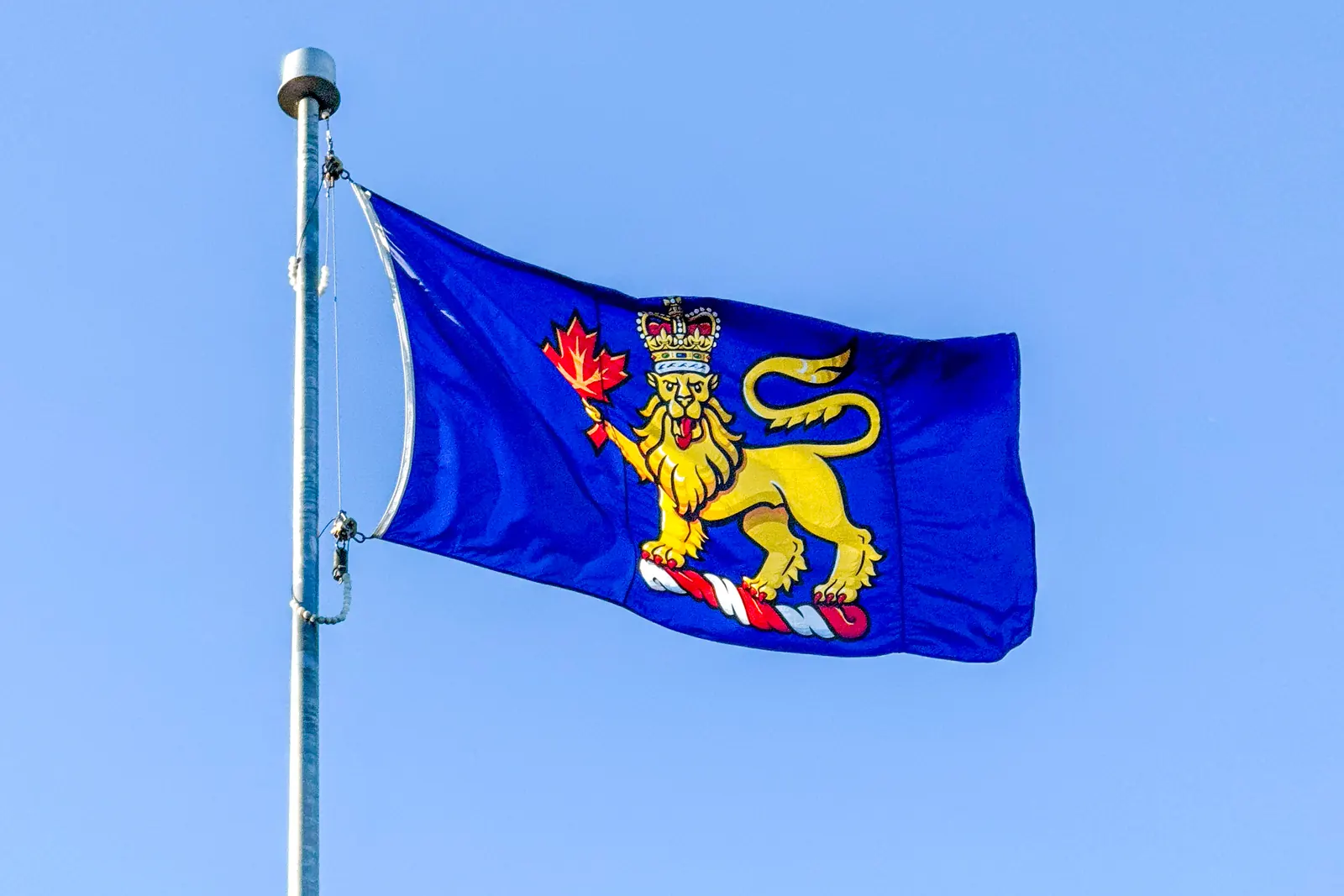 The flag of the Governor General of Canada, a crowned lion holding a maple leaf on blue, on the Citadelle of Québec