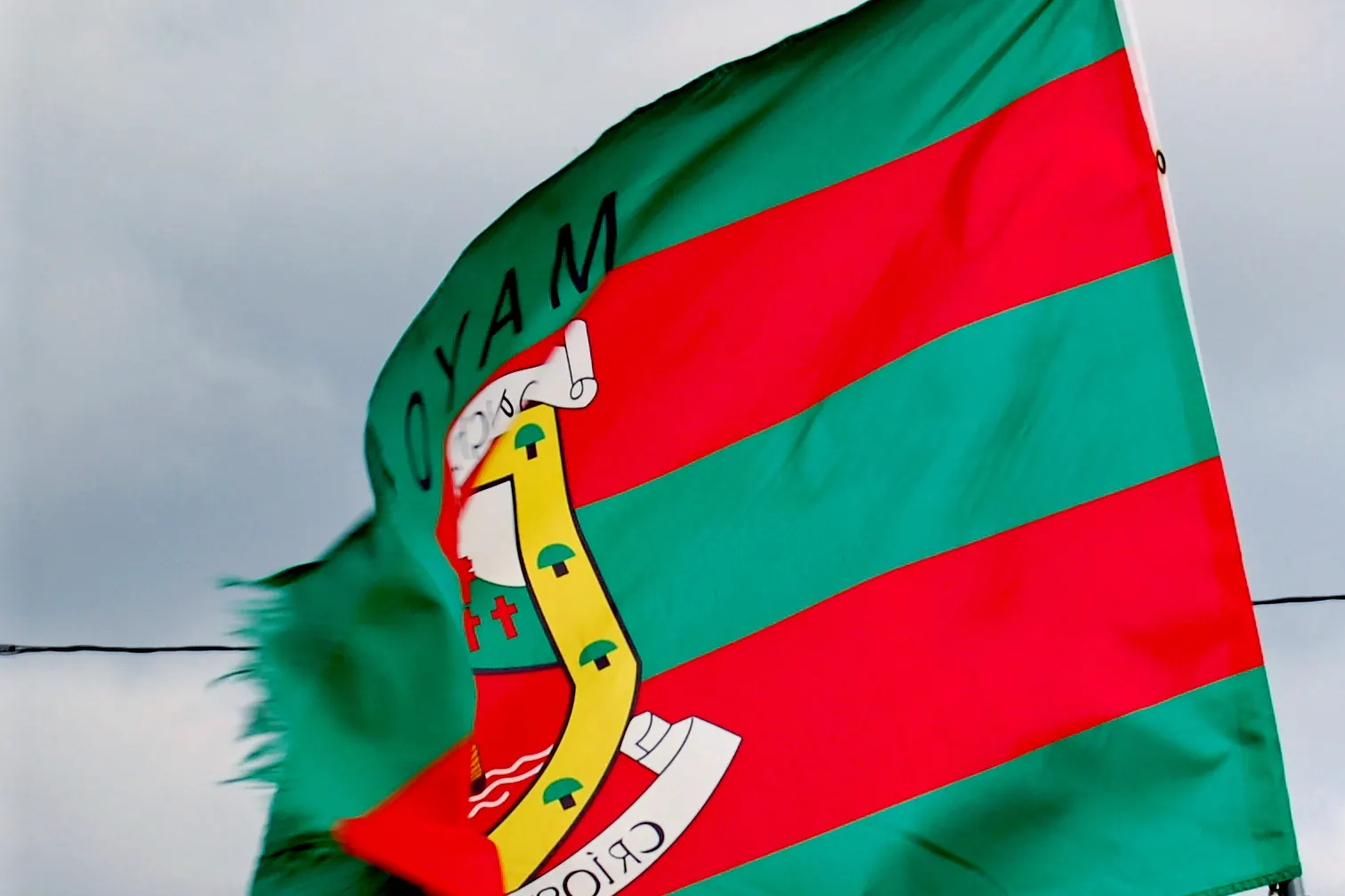 The County Mayo flag blowing in the wind at Keel on Achill Island