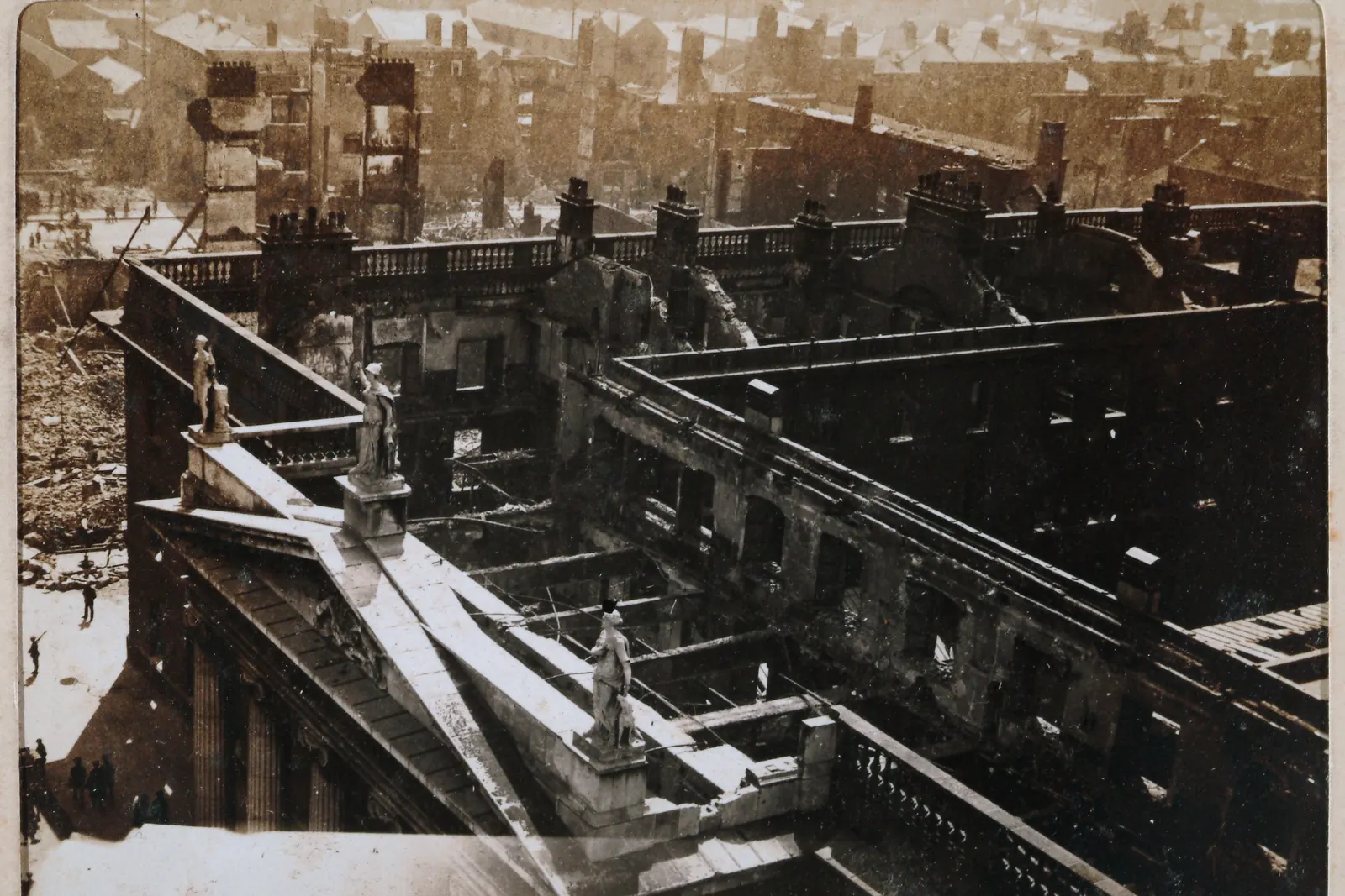 The ruined General Post Office in Dublin after the Easter Rising, seen from Nelson’s Pillar, with the flagstaff at the corner