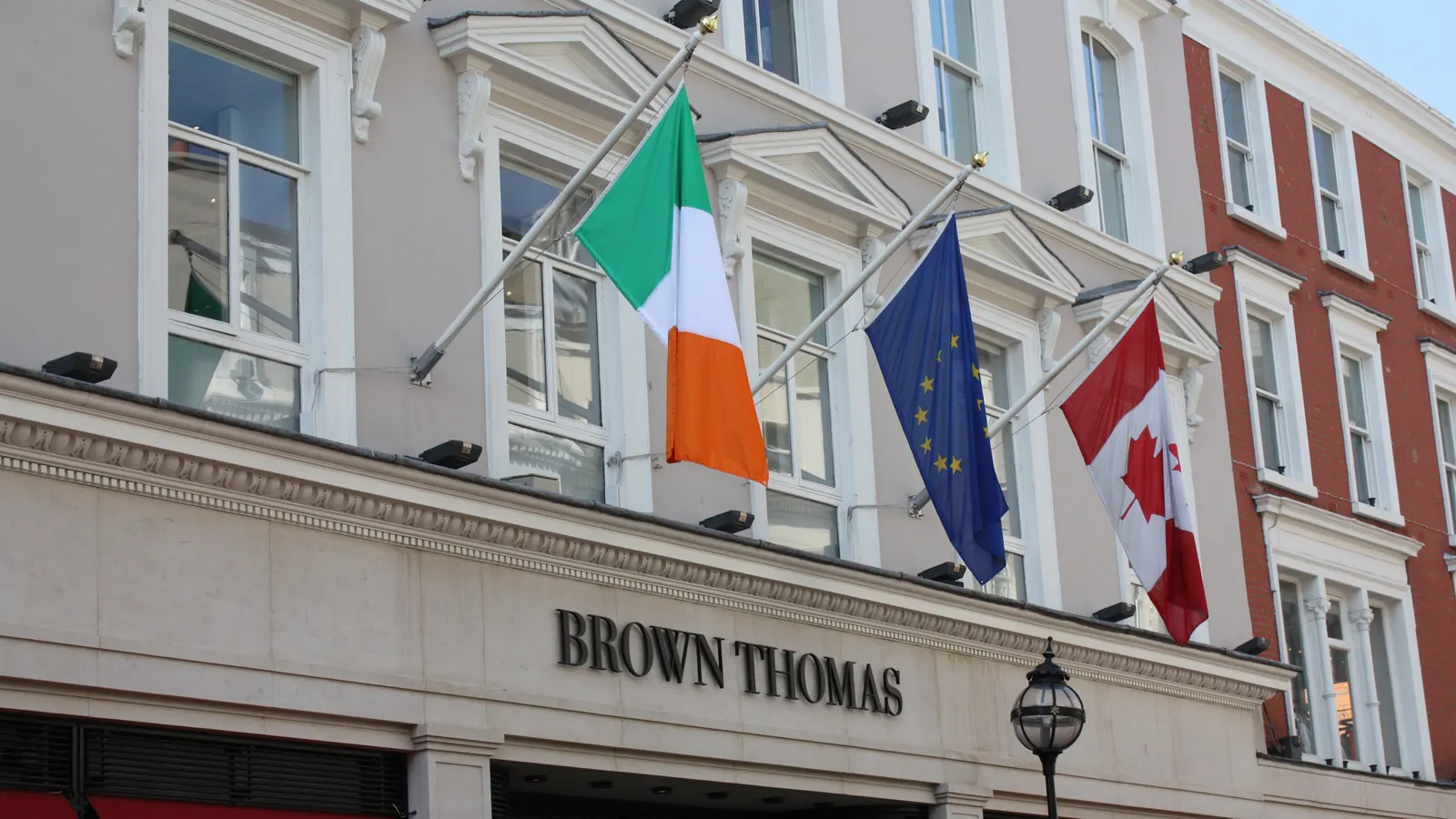 The flags of Ireland, the European Union and Canada on the Brown Thomas store in Dublin