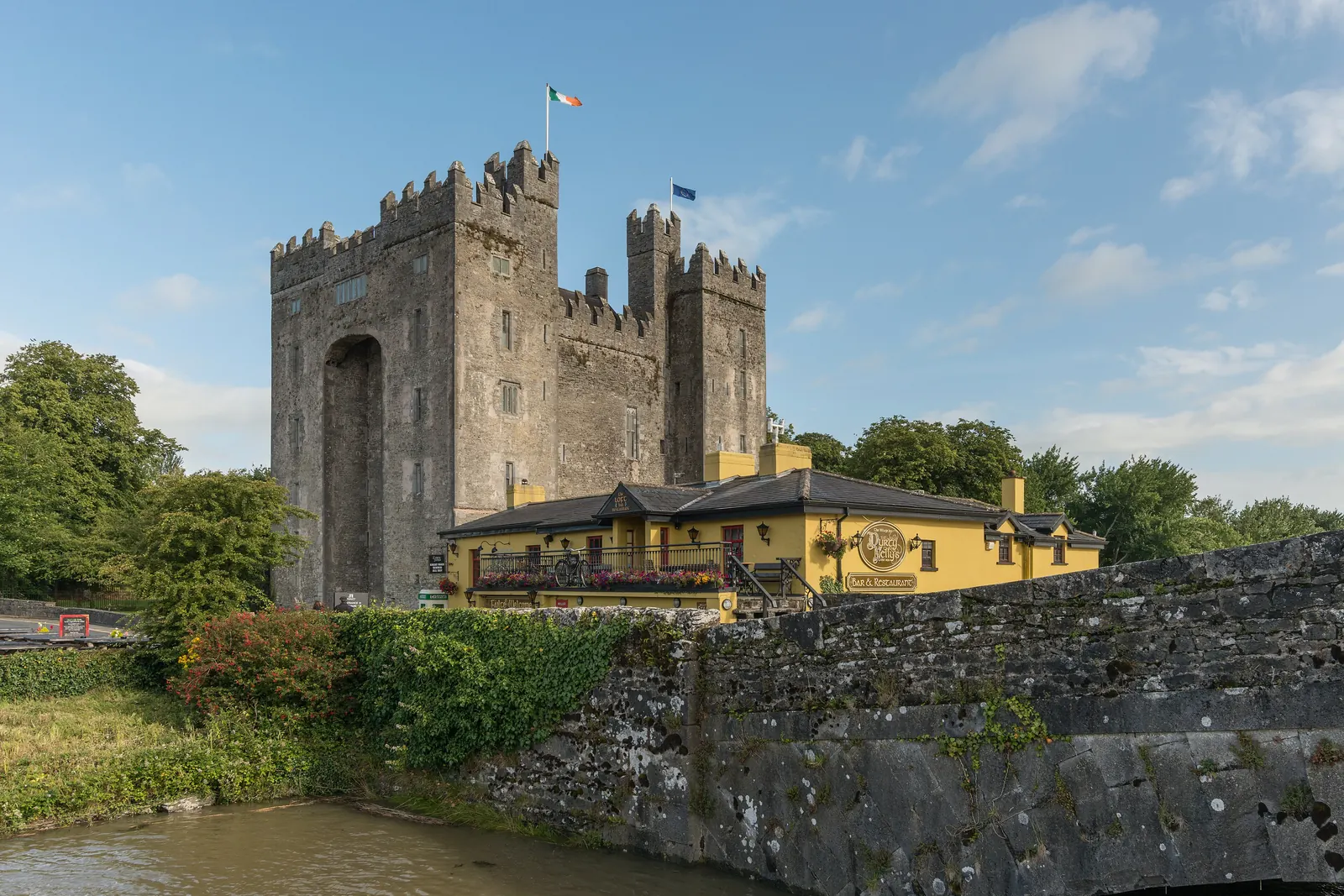 Bunratty Castle in County Clare with a flag on the tower