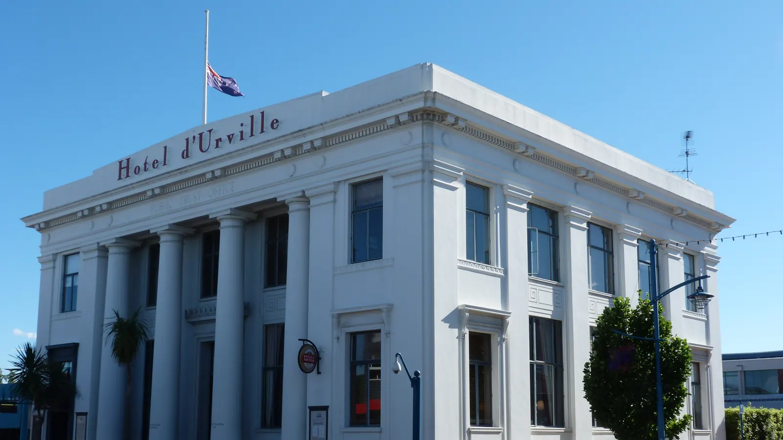Hotel D’Urville in Blenheim with the New Zealand flag at half-mast on the roof after the Christchurch earthquake of February 2011
