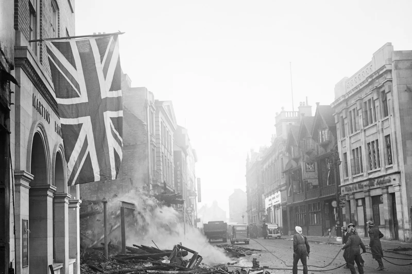 A Union Flag hanging from a damaged building in Coventry after the air raid of 14–15 November 1940