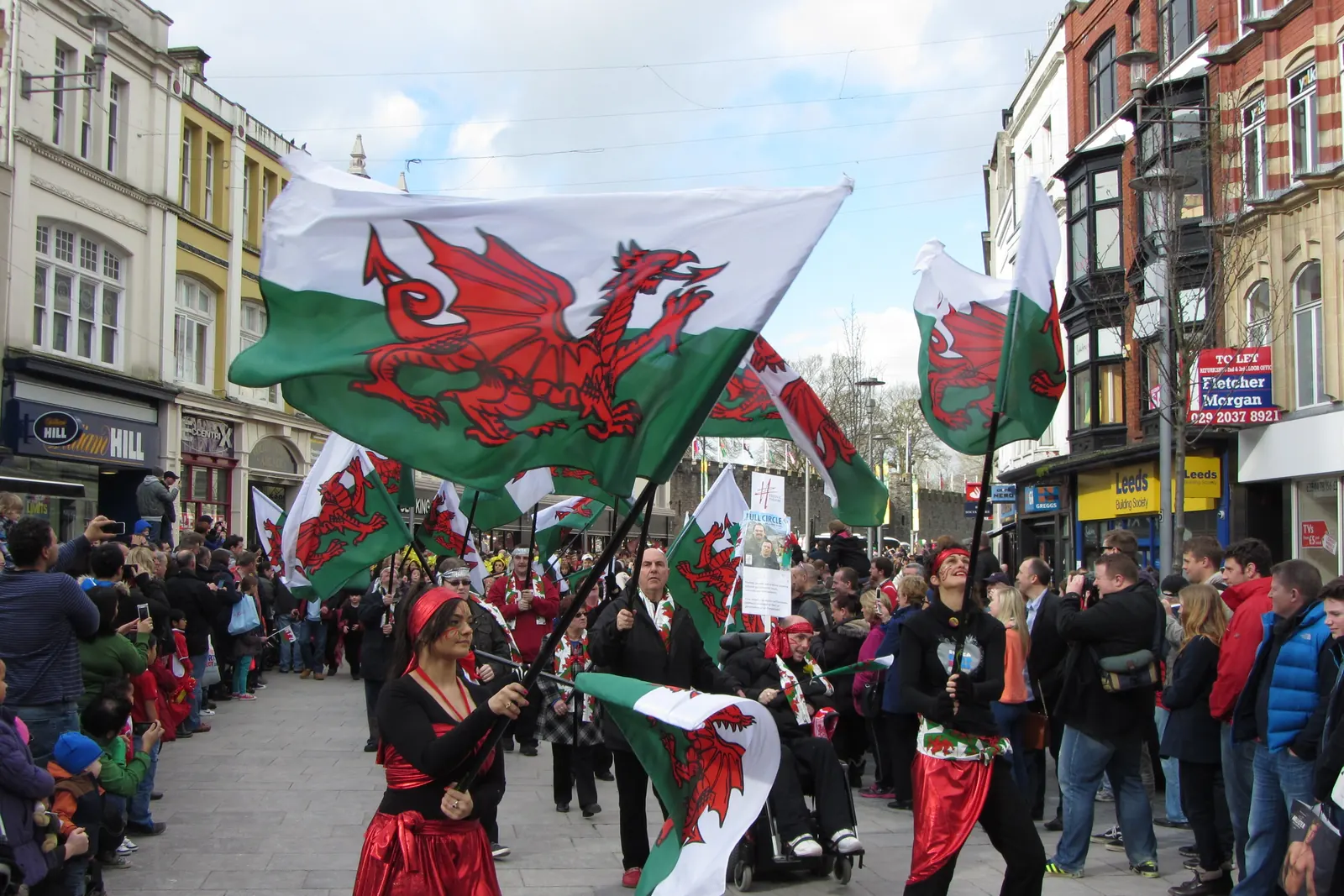 A St David’s Day parade with Welsh flags in Cardiff