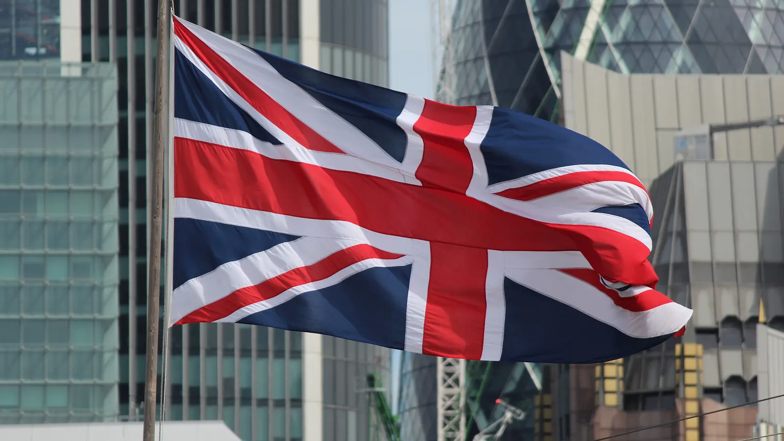 The Union Flag flying in front of office towers in the City of London