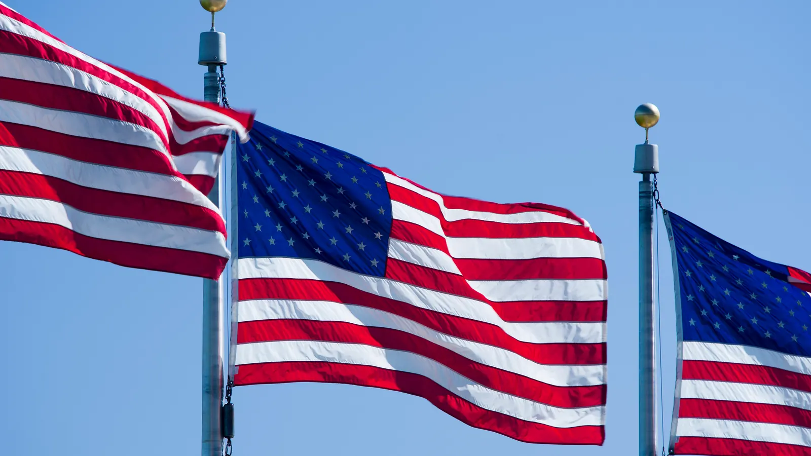The stars and stripes of the flag of the United States flying at the Washington Monument