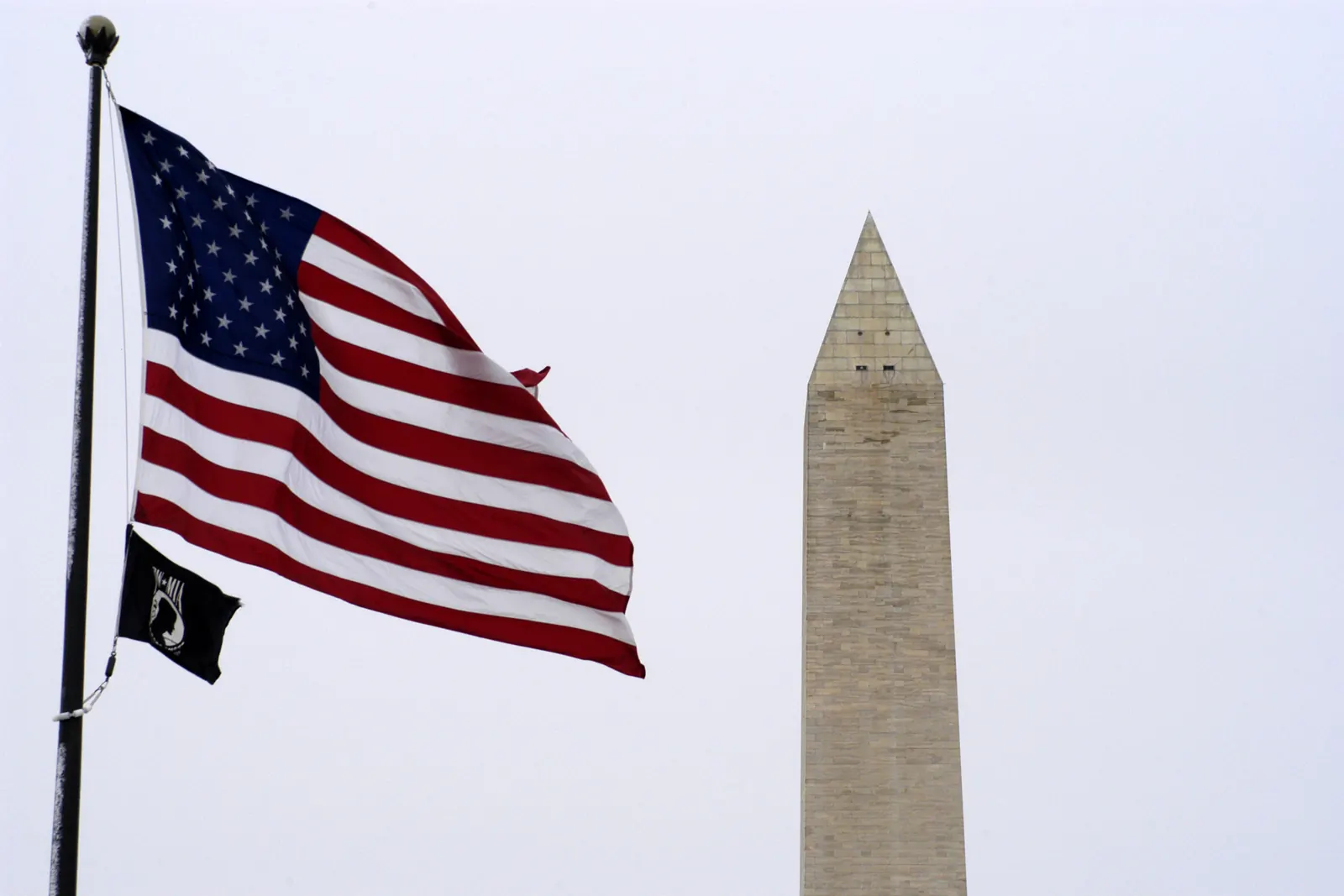 The flag of the United States above the POW/MIA flag in front of the Washington Monument