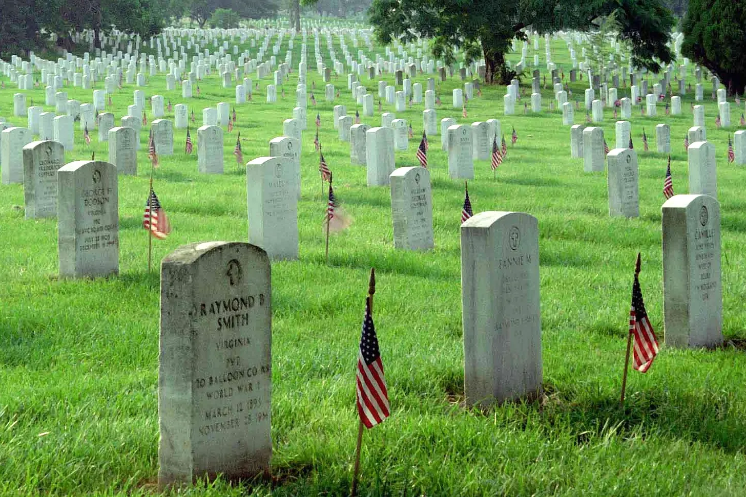 Headstones with small flags at Arlington National Cemetery
