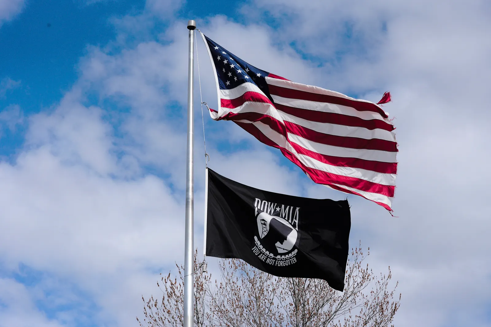The POW/MIA flag below the flag of the United States on the same flagpole
