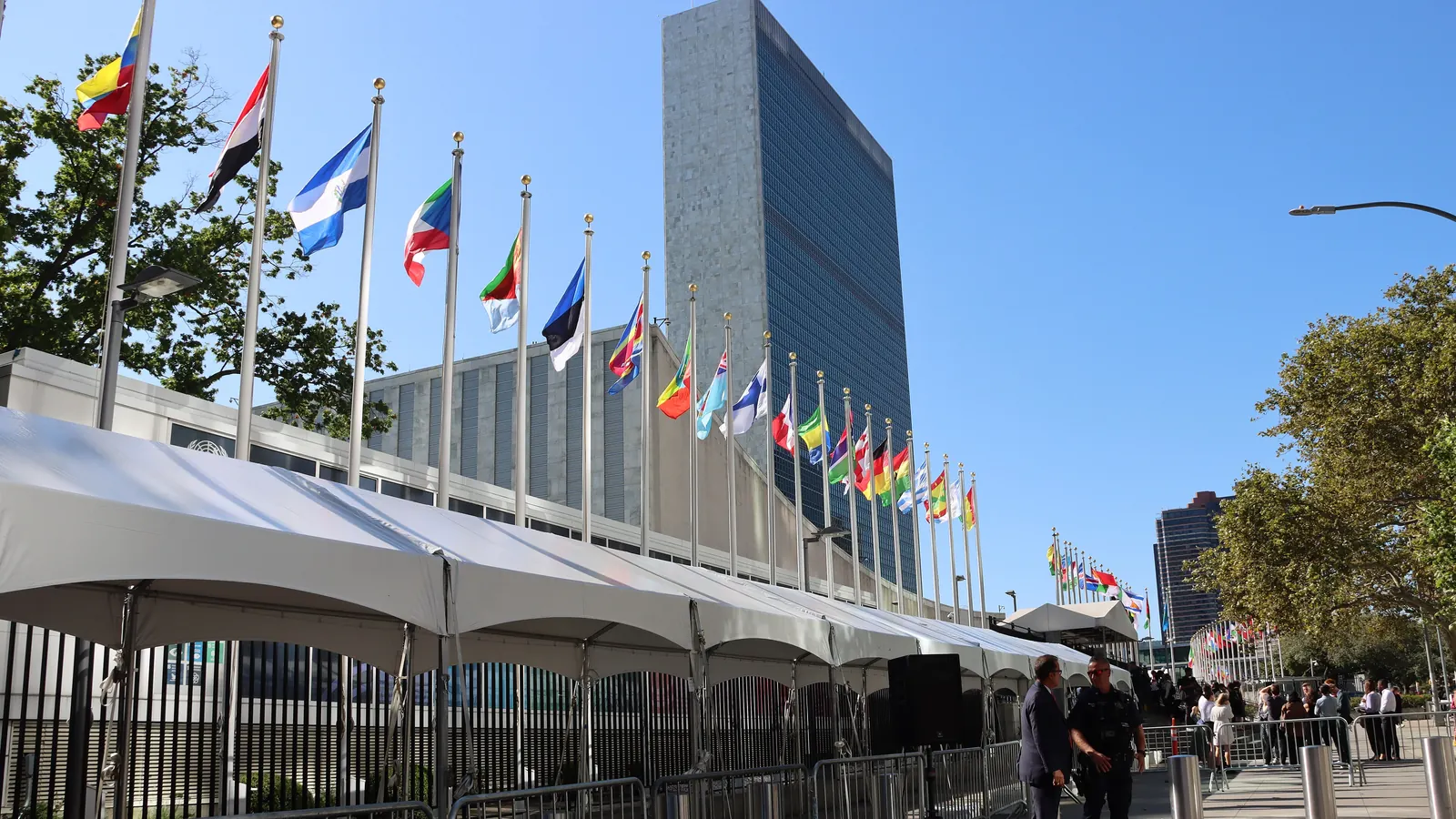 The flags of the member states in a row at the United Nations headquarters in New York