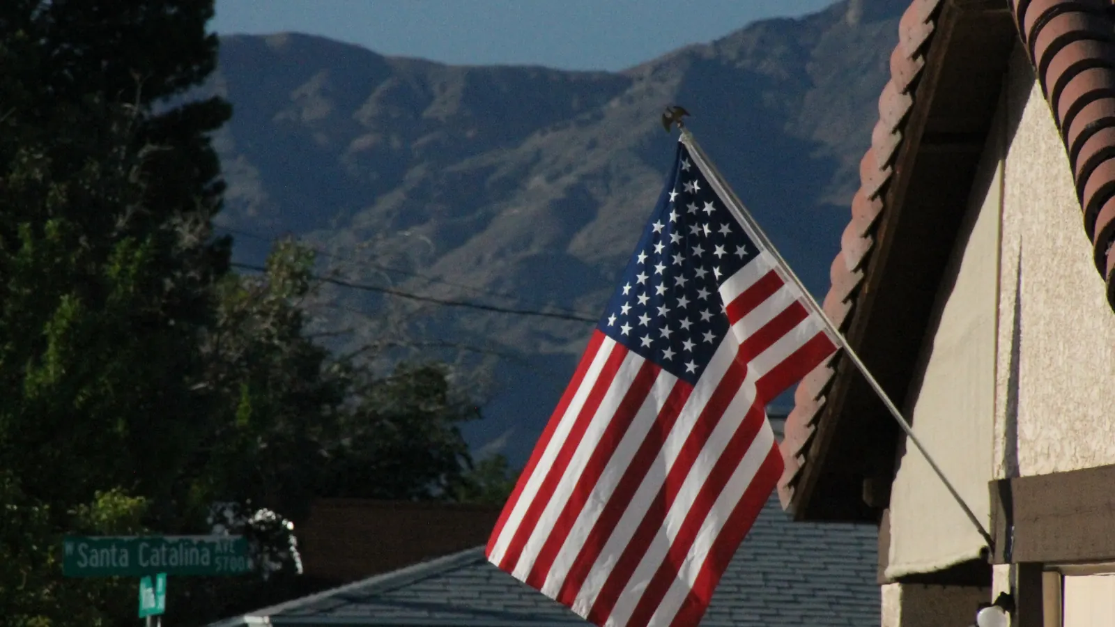 The flag of the United States in a bracket on the wall of a house