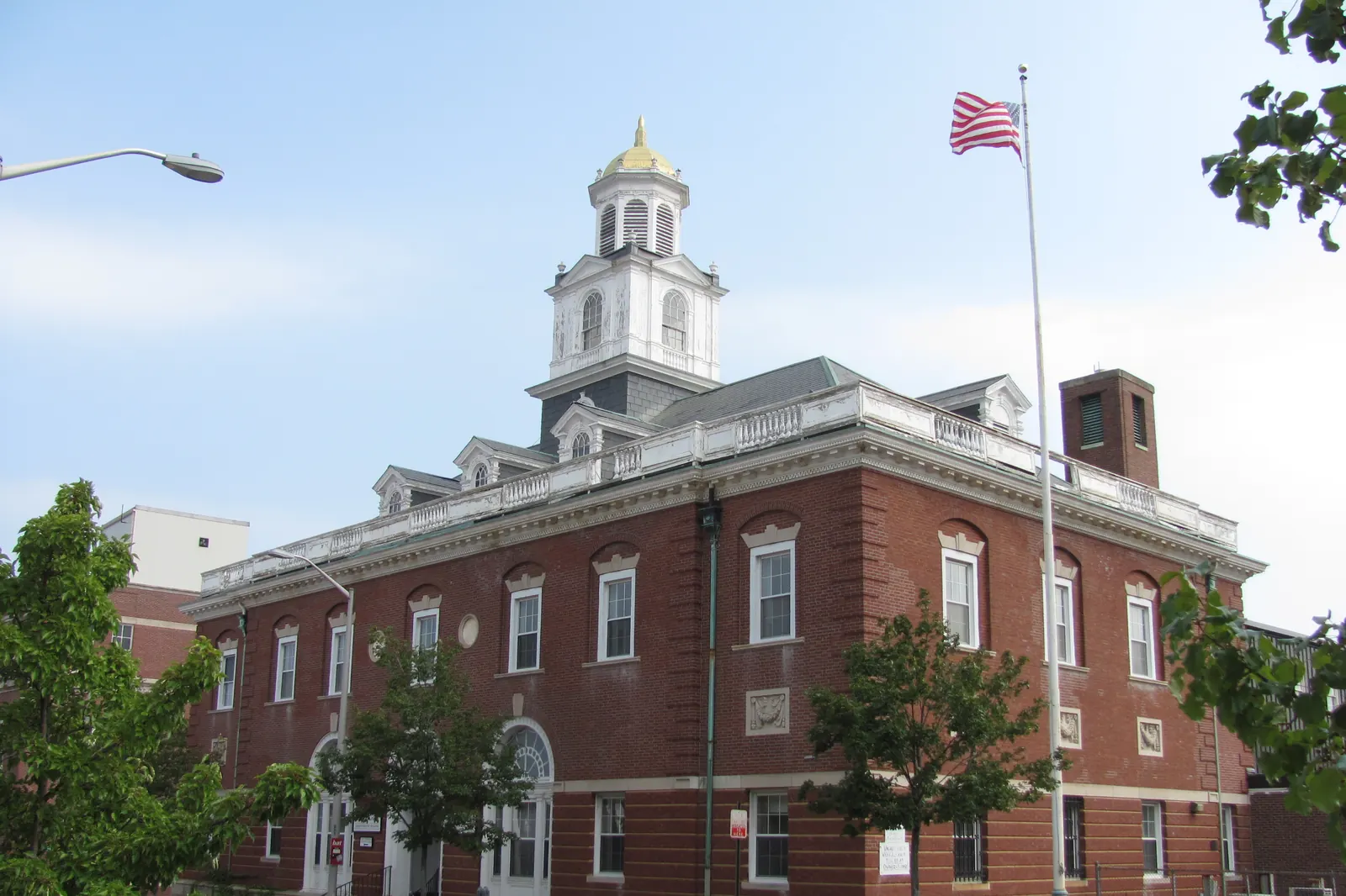 The Old Post Office Building in Brockton, Massachusetts, with a flagpole